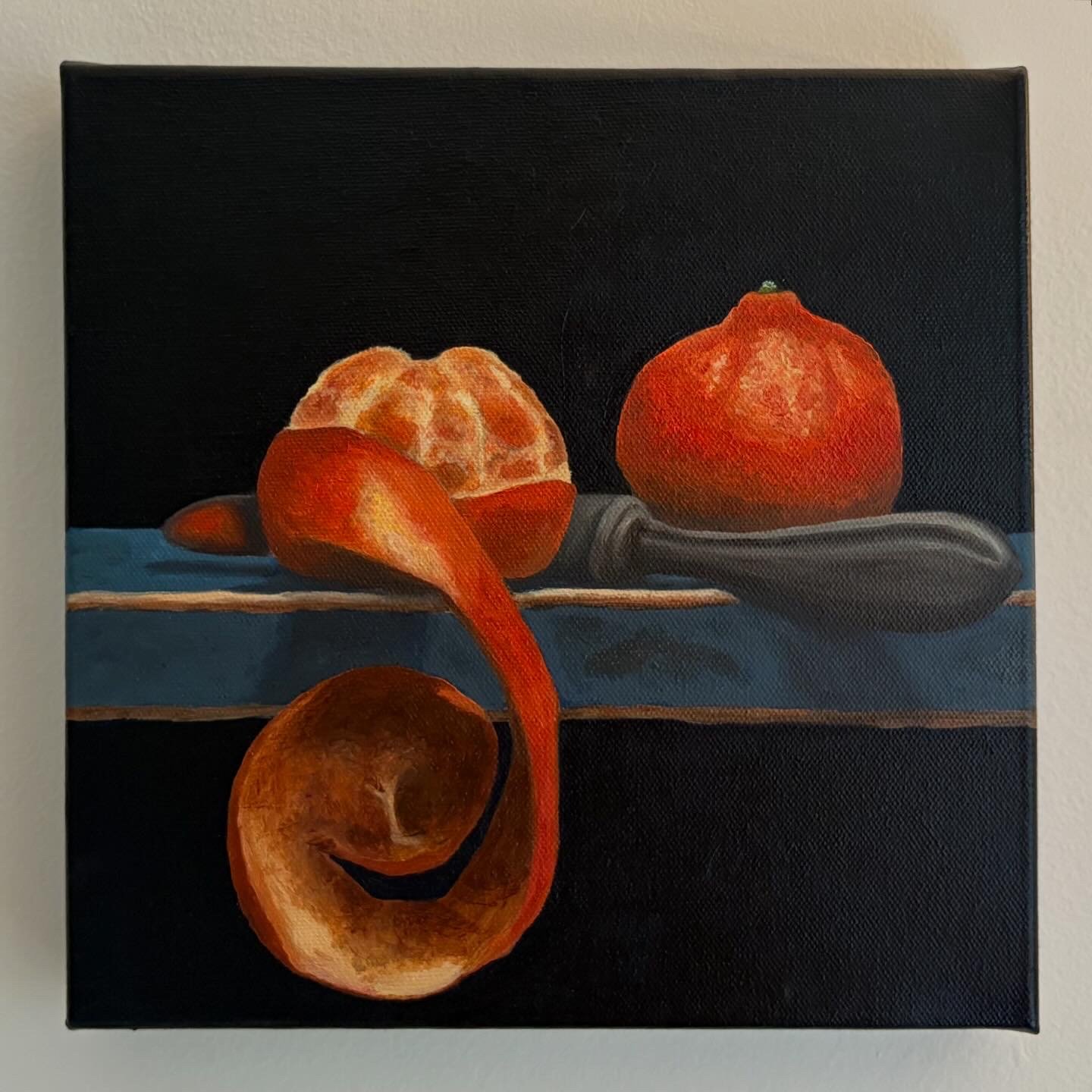 Small oil still life study of tangerines and a peeled peel